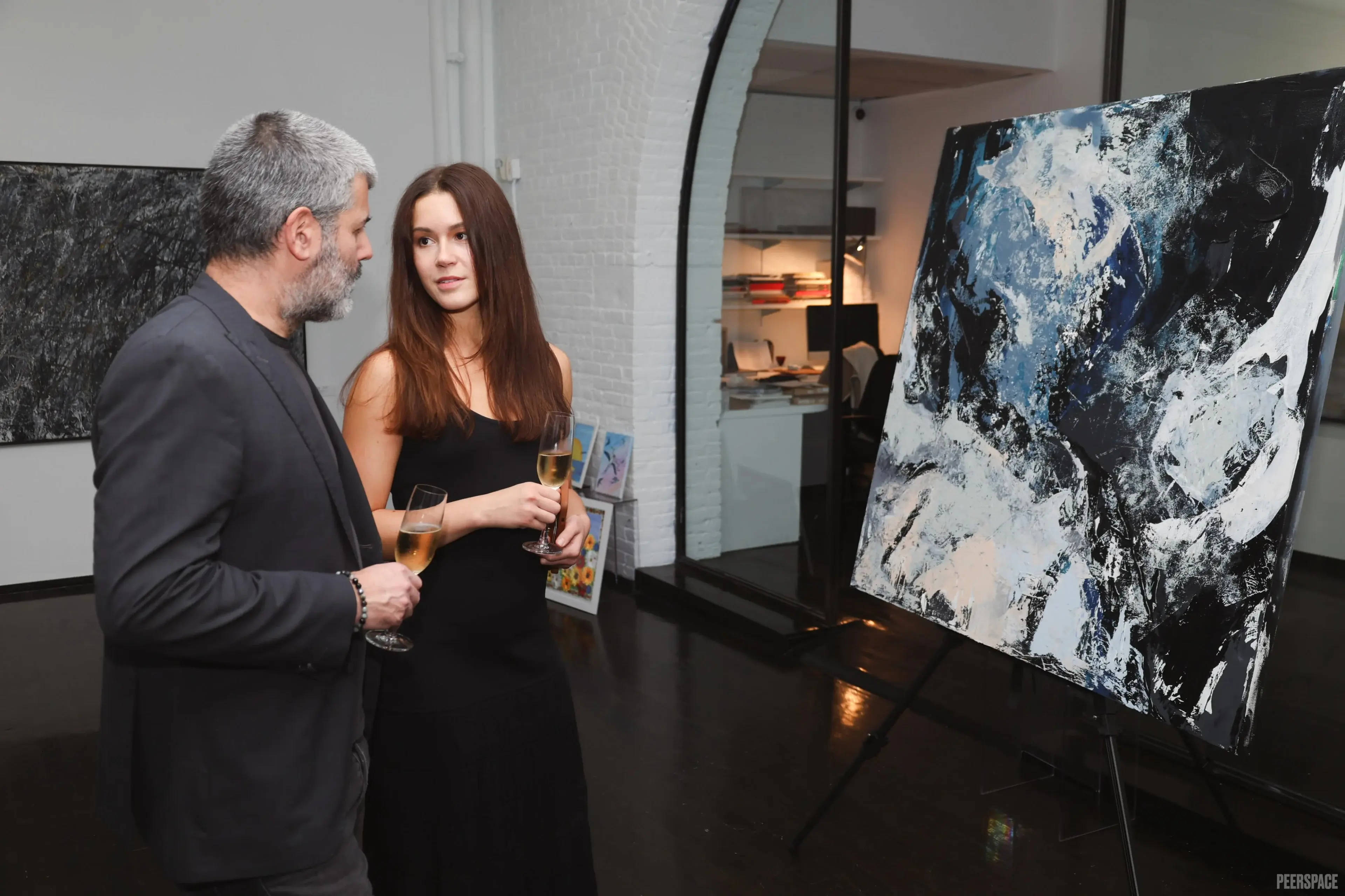 Guests viewing artwork at a Chelsea Studio event
